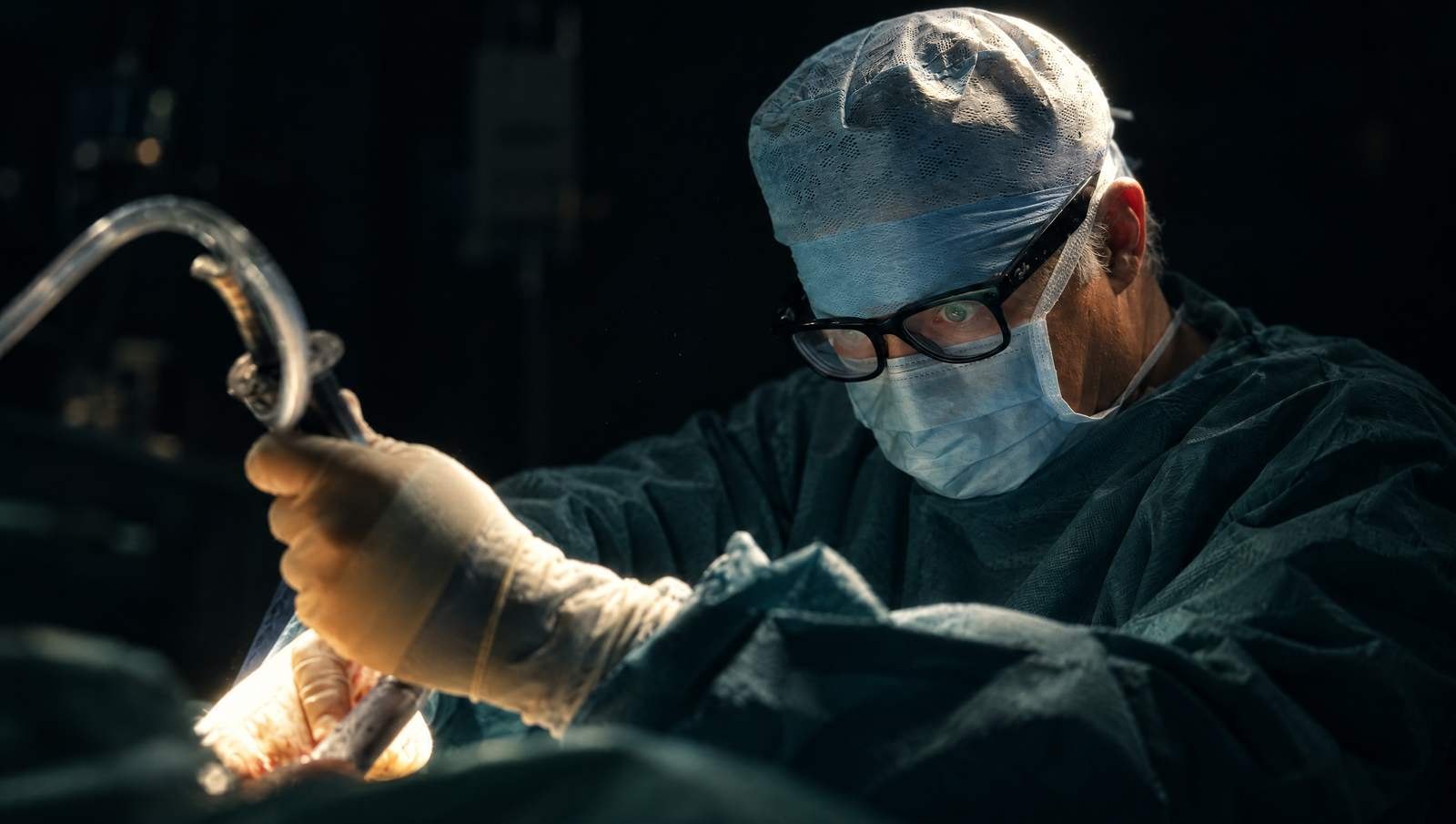 Mr Reza Nassab, Consultant Plastic Surgeon, in theatre