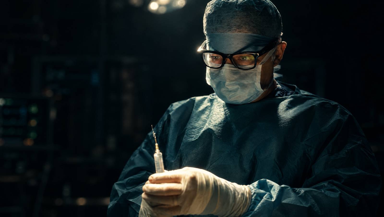 Mr Reza Nassab, Consultant Plastic Surgeon, in theatre