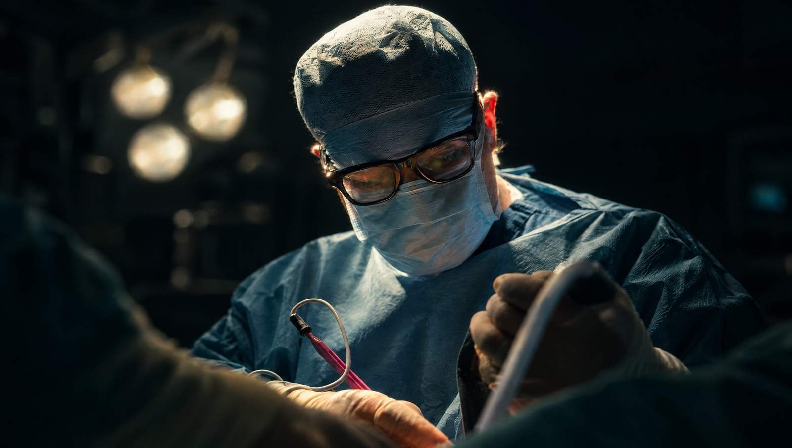 Mr Reza Nassab, Consultant Plastic Surgeon, in theatre