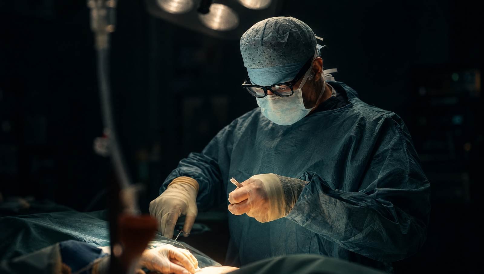 Mr Reza Nassab, Consultant Plastic Surgeon, in theatre