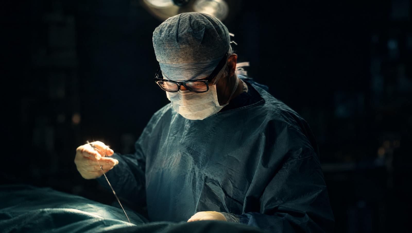Mr Reza Nassab, Consultant Plastic Surgeon, in theatre