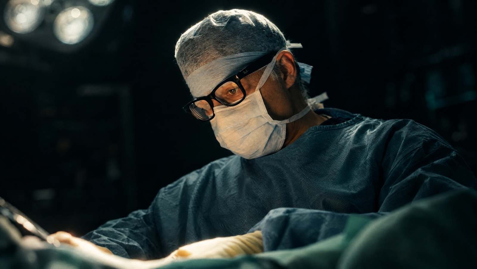 Mr Reza Nassab, Consultant Plastic Surgeon, in theatre