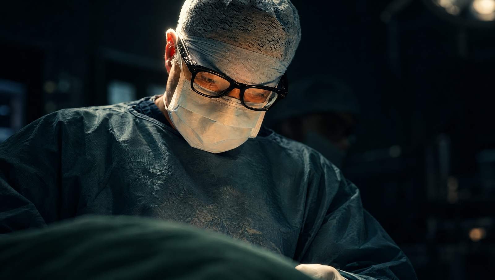 Mr Reza Nassab, Consultant Plastic Surgeon, in theatre